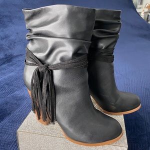 Bebe black ankle boots with tassel trim